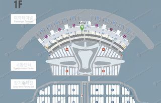 Terminal 1 1F floor plan showing smoking room marker near passenger terminal entrance