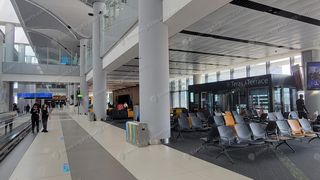 Istanbul Airport F concourse corridor with Teras Terrace smoking room entrance and rows of gate seating (2)