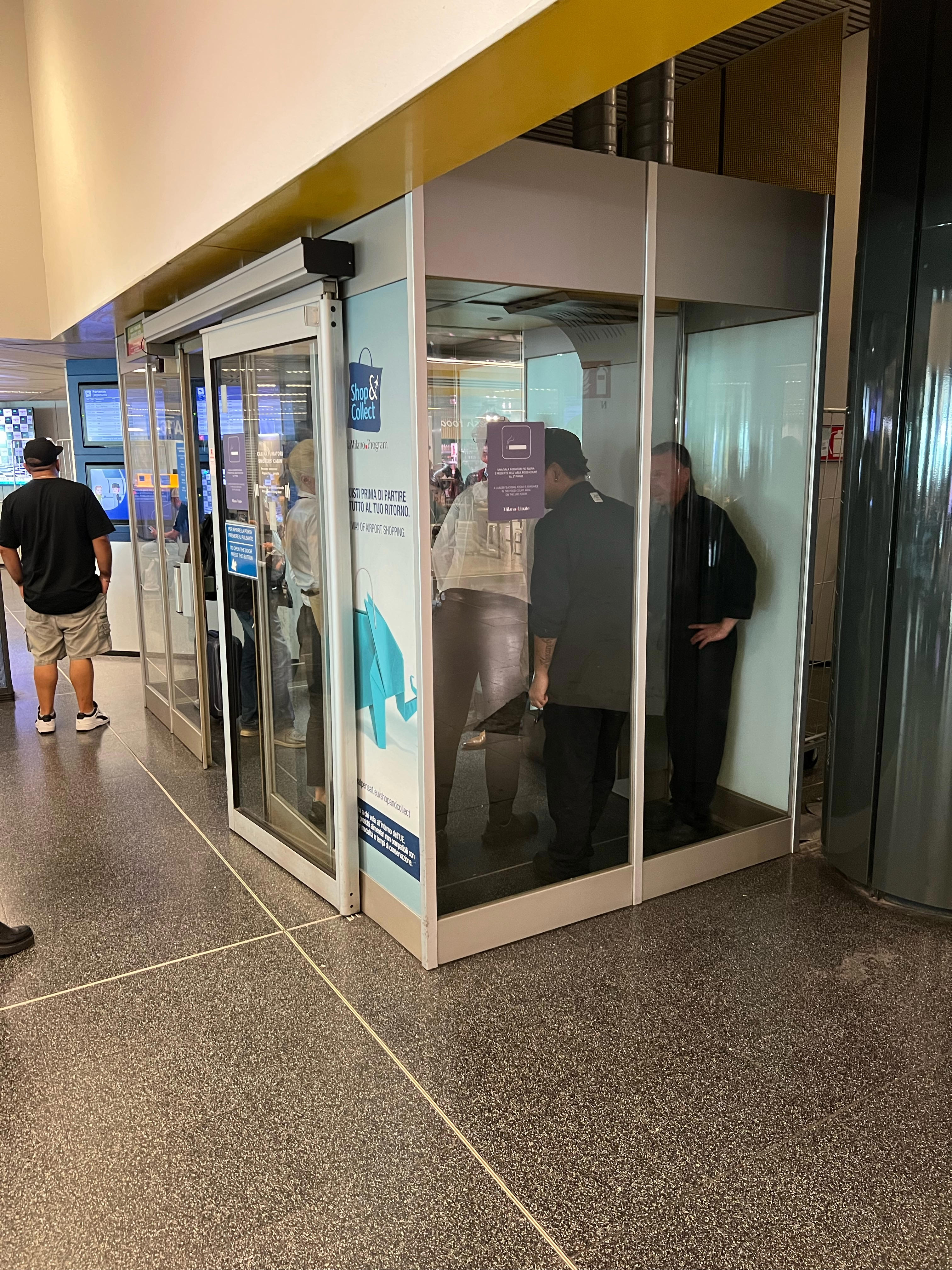 Smoking glass box near Gate A10
